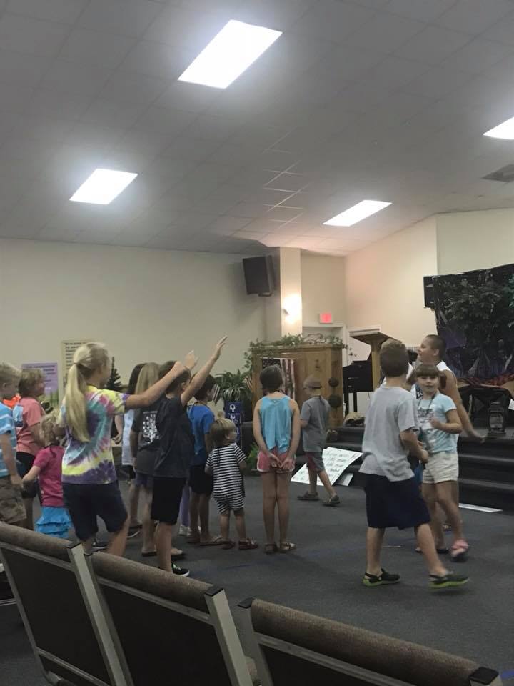 Worship team leading singing at the church